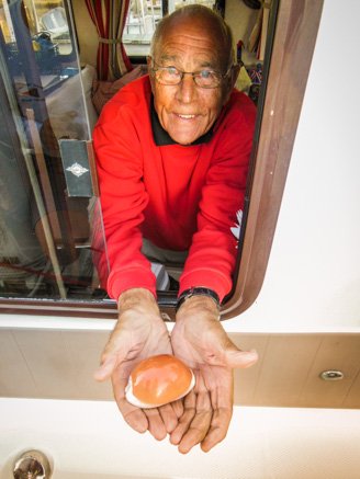 Man with Shell in Hands